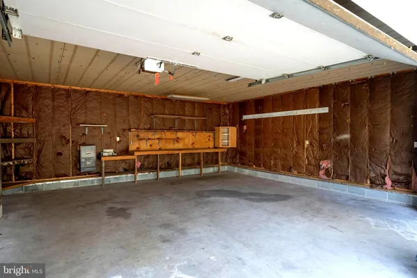 a view of a room with wooden walls