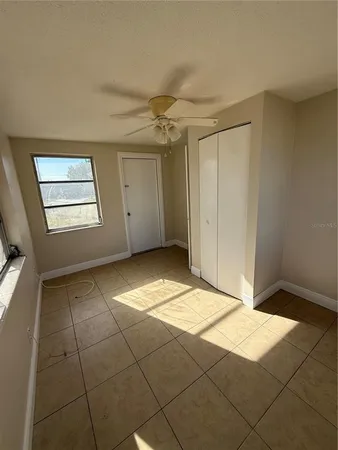 a view of an empty room and window