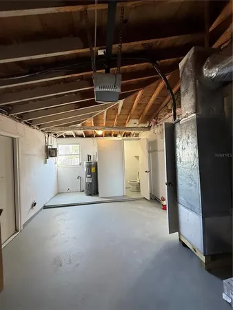 a view of empty room with wooden walls