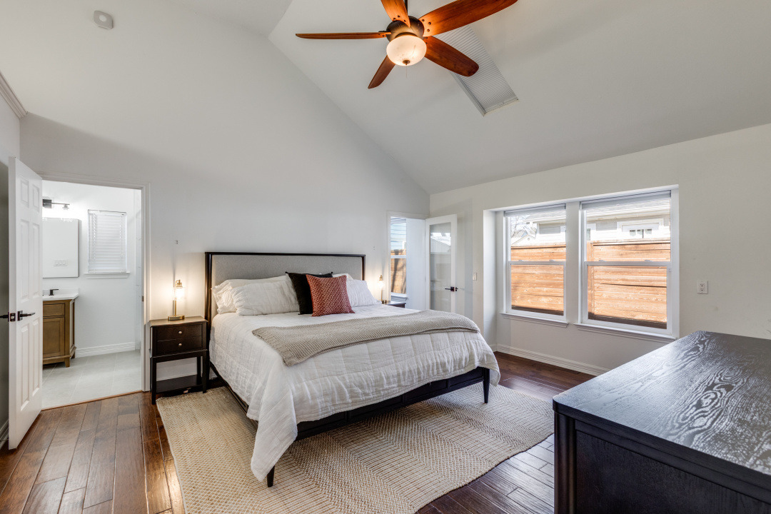 1113 Taulbee Lane Austin, TX 78757 - Photo 15 of 35 a bedroom with a bed and window