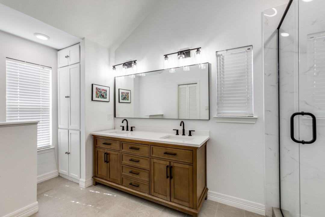 1113 Taulbee Lane Austin, TX 78757 - Photo 17 of 35 a bathroom with a double vanity sink and mirror