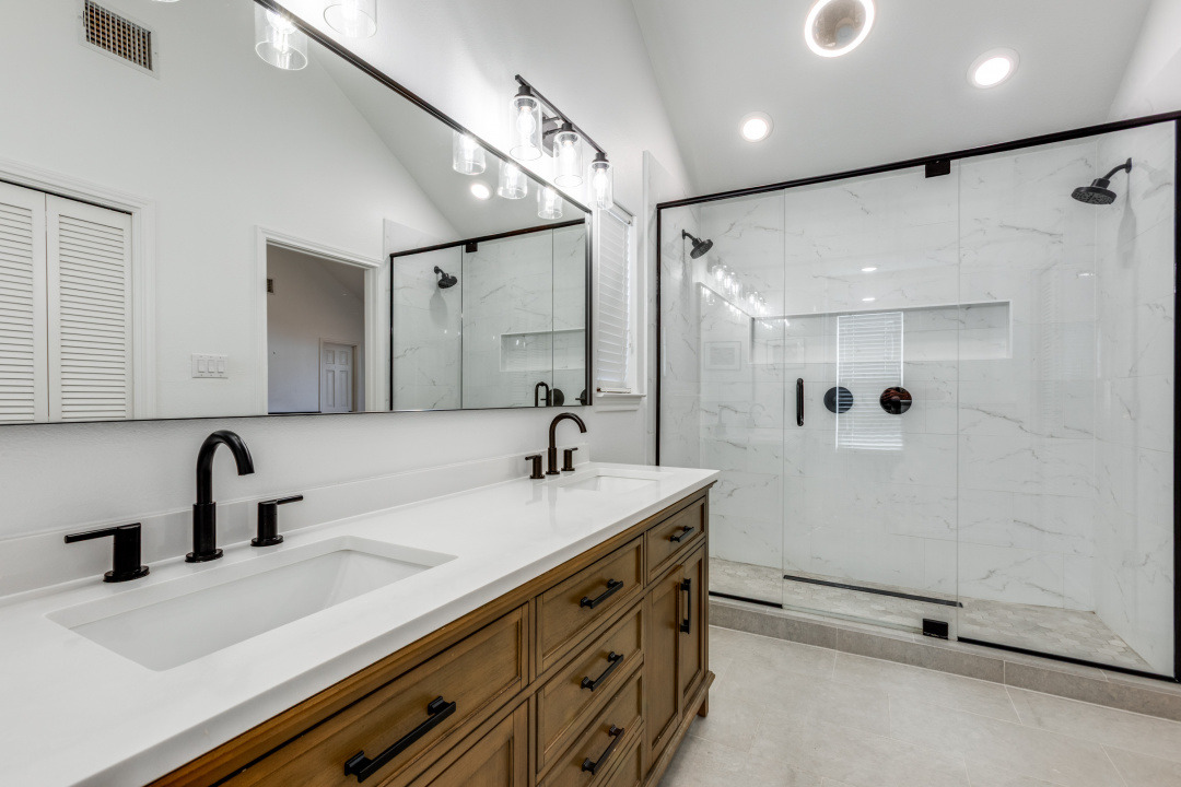 1113 Taulbee Lane Austin, TX 78757 - Photo 18 of 35 a bathroom with a double vanity sink a mirror and shower