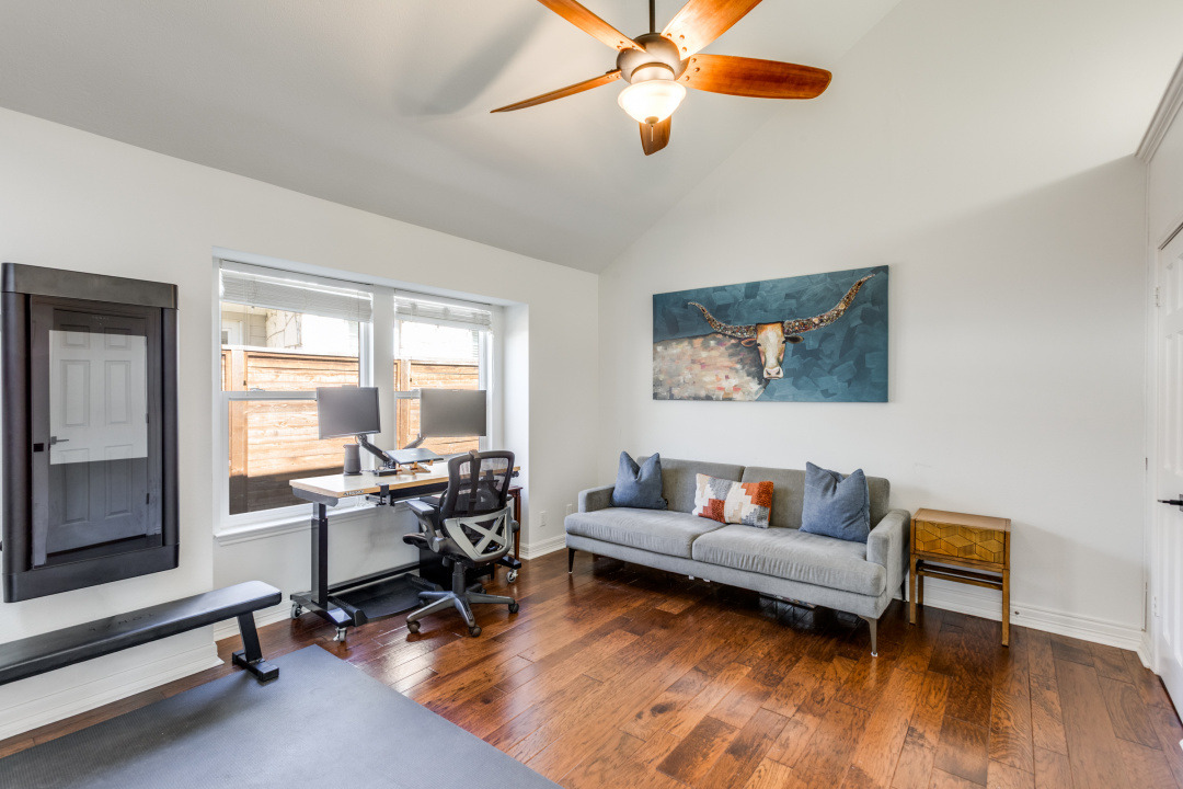 1113 Taulbee Lane Austin, TX 78757 - Photo 19 of 35 a living room with furniture and a large window