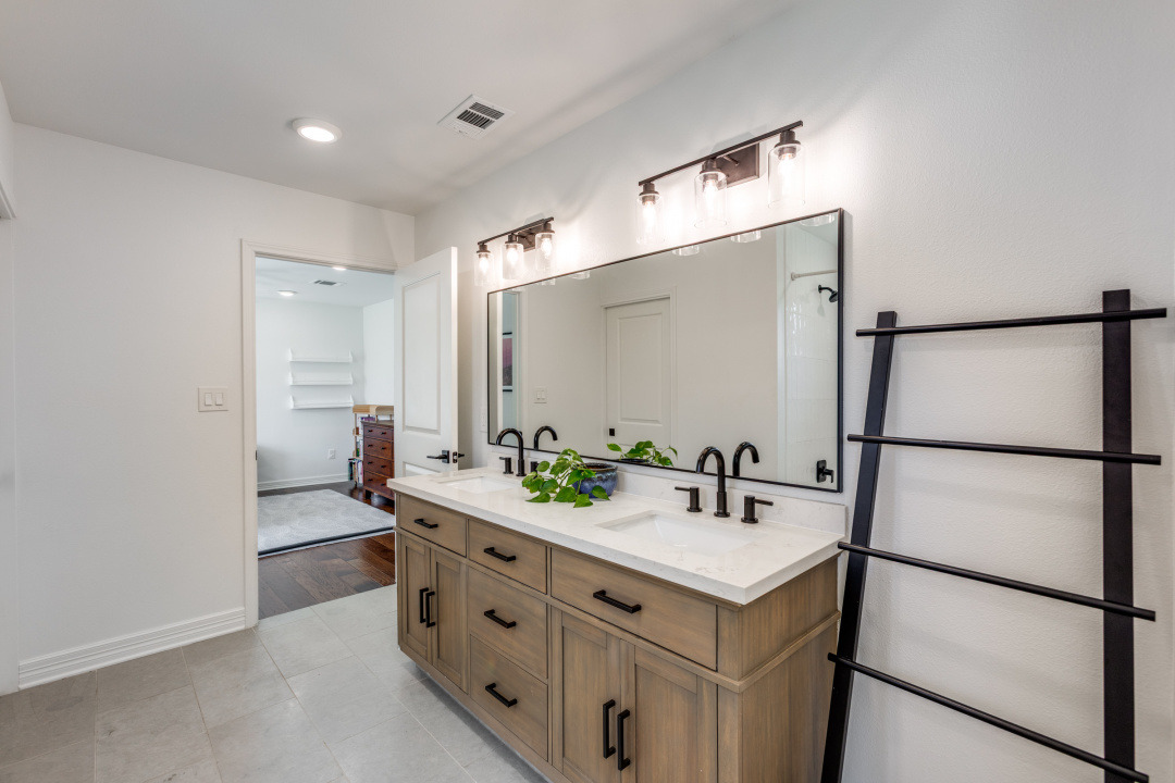 1113 Taulbee Lane Austin, TX 78757 - Photo 27 of 35 a bathroom with a double vanity sink mirror and double