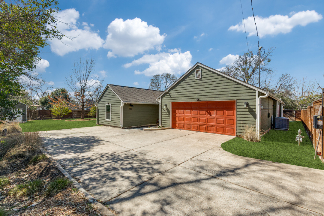 1113 Taulbee Lane Austin, TX 78757 - Photo 3 of 35 a front view of a house with a yard and garage