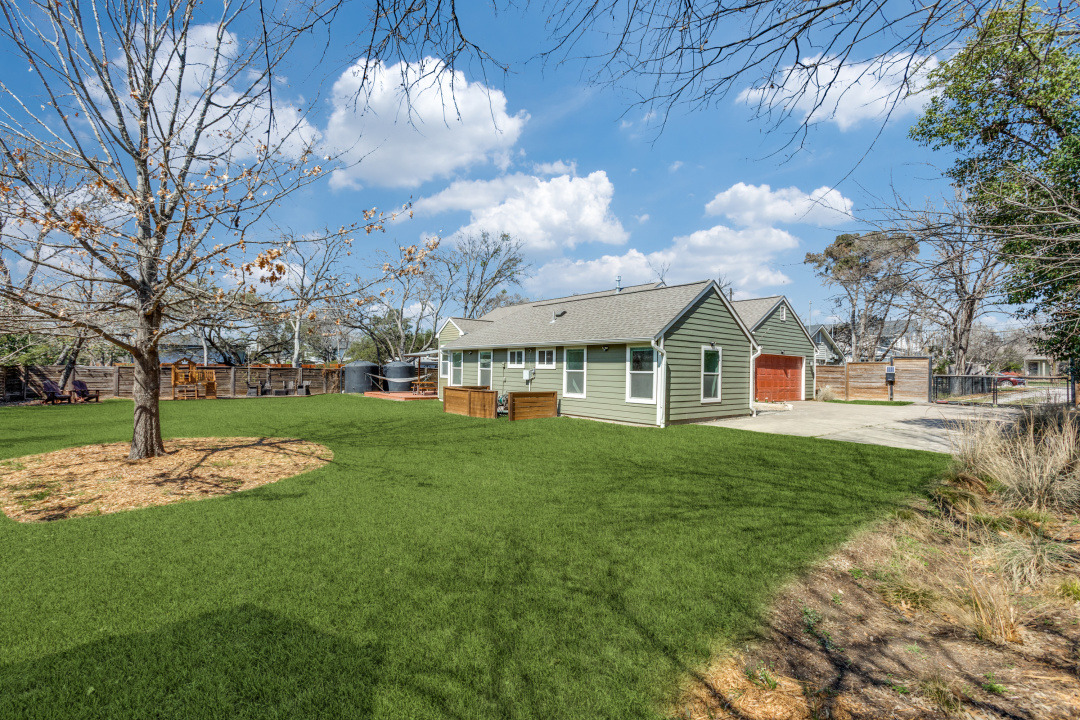 1113 Taulbee Lane Austin, TX 78757 - Photo 32 of 35 a view of a house with a yard