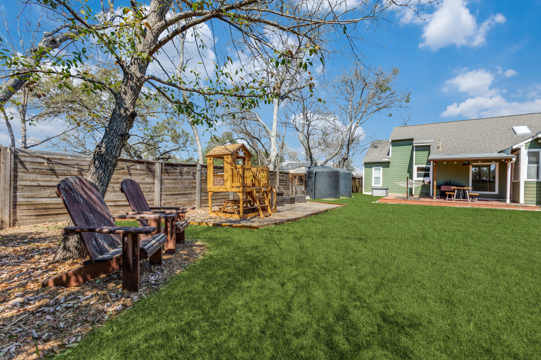 1113 Taulbee Lane Austin, TX 78757 - Photo 34 of 35 a view of a house with backyard porch and sitting area
