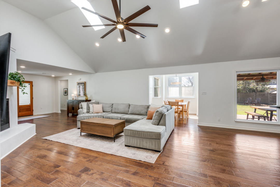 1113 Taulbee Lane Austin, TX 78757 - Photo 5 of 35 a living room with furniture and a wooden floor
