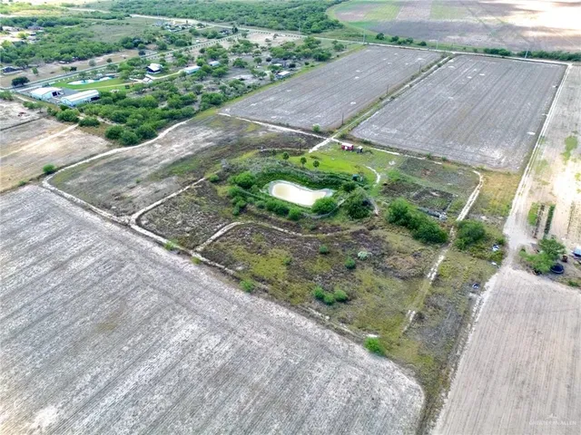 a aerial view of a house with a yard