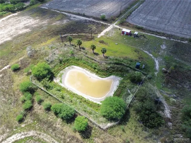 a view of a backyard with swimming pool