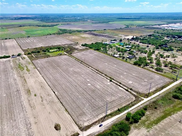 a view of a field with an outdoor space and seating area
