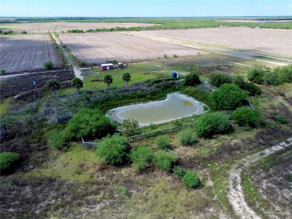 10220 Big 5 Road Edinburg, TX 78541 - Photo 7 of 16 a view of a field with an outdoor space and seating area
