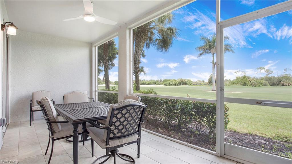 6025 Pinnacle Lane, Unit 6602 Naples, FL 34110 - Photo 22 of 43 a view of a room with a table and chairs