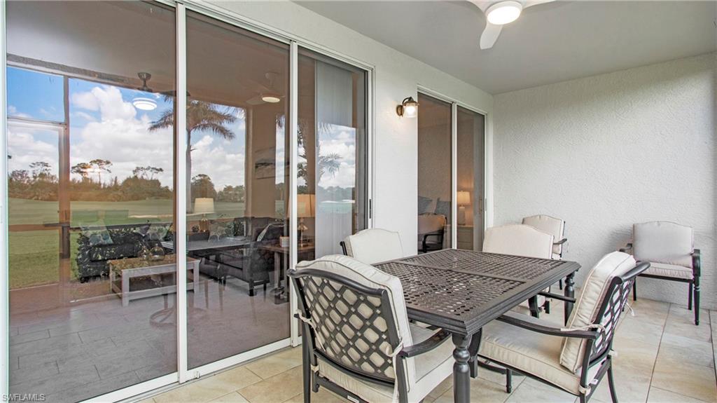 6025 Pinnacle Lane, Unit 6602 Naples, FL 34110 - Photo 23 of 43 a view of a dining room with furniture window and outside view