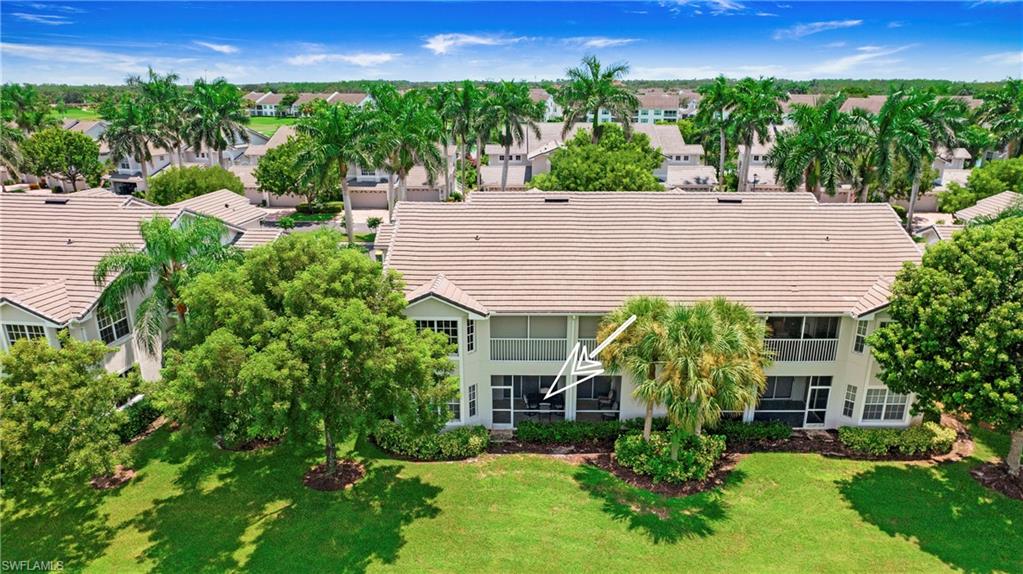 6025 Pinnacle Lane, Unit 6602 Naples, FL 34110 - Photo 30 of 43 a aerial view of a house with a yard and plants