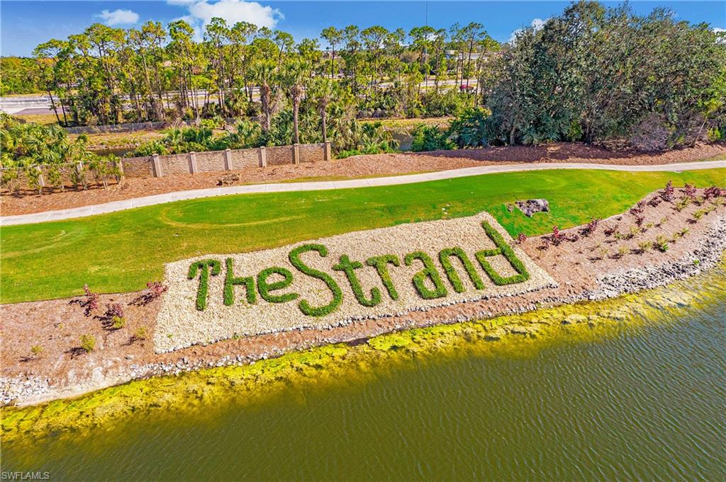 6025 Pinnacle Lane, Unit 6602 Naples, FL 34110 - Photo 31 of 43 a sign that is sitting on the side of a road