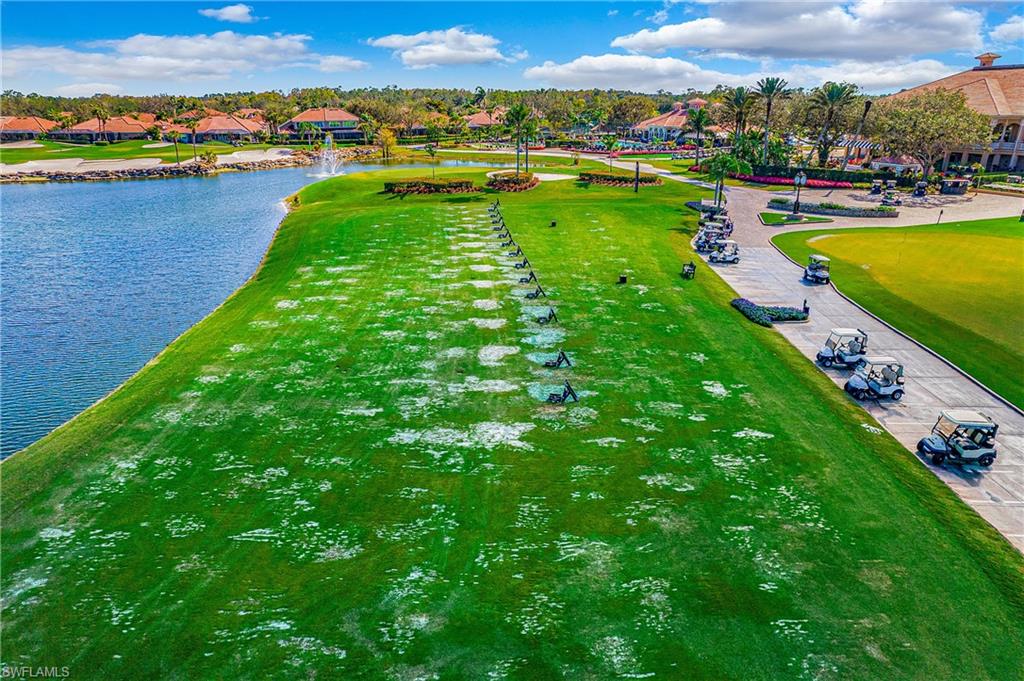 6025 Pinnacle Lane, Unit 6602 Naples, FL 34110 - Photo 40 of 43 a view of a lake with a city