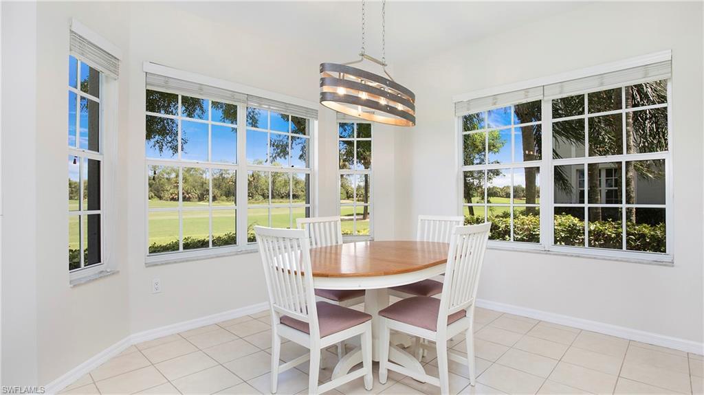 6025 Pinnacle Lane, Unit 6602 Naples, FL 34110 - Photo 7 of 43 a dining room with furniture and windows
