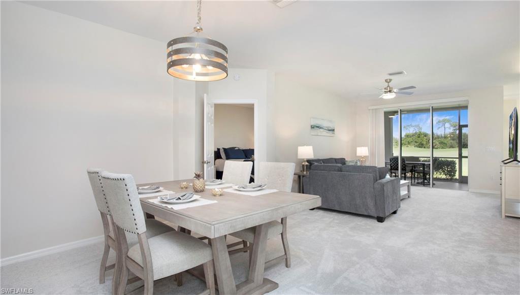 6025 Pinnacle Lane, Unit 6602 Naples, FL 34110 - Photo 9 of 43 a view of a dining room with furniture