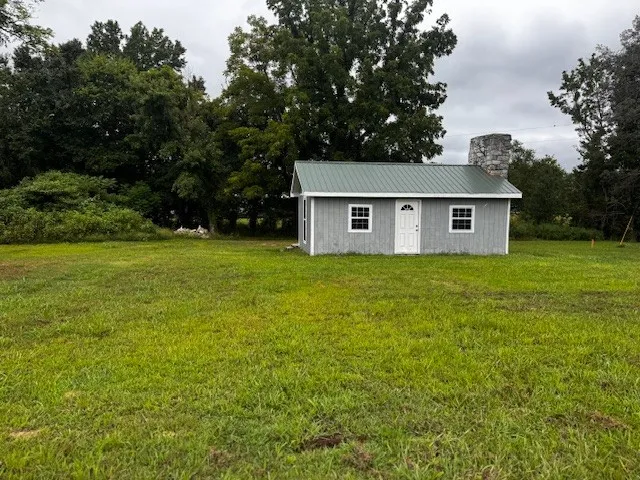 a view of a house with a big yard
