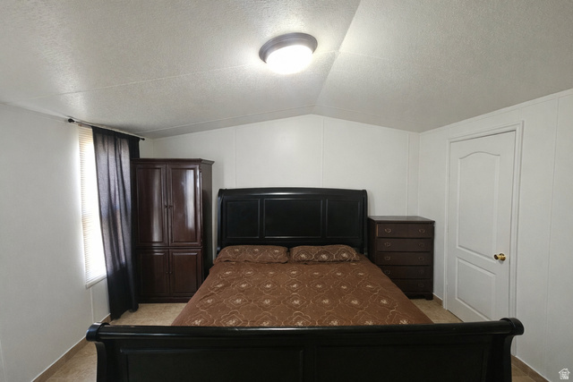 340 West 920 South, Unit 16 Provo, UT 84601 - Photo 7 of 15 Bedroom featuring a decorative wall