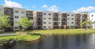 a view of a swimming pool with a lounge chair