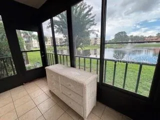 a bedroom with a bed and a view of balcony