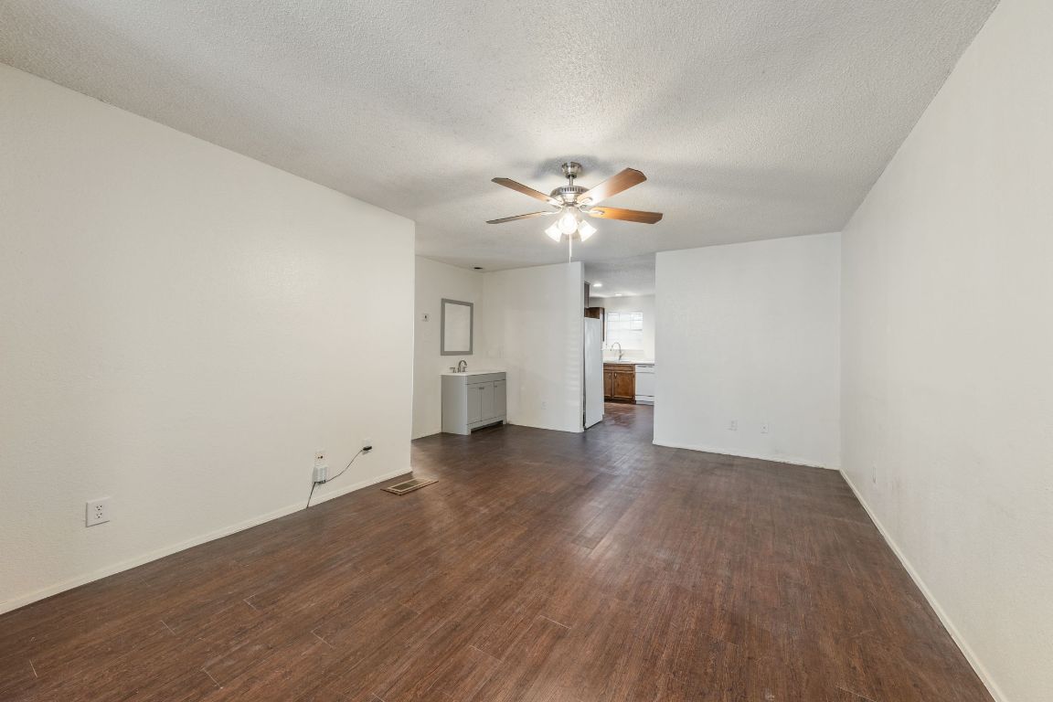 4518 Speedway, Unit B Austin, TX 78751 - Photo 2 of 7 wooden floor in an empty room with a window
