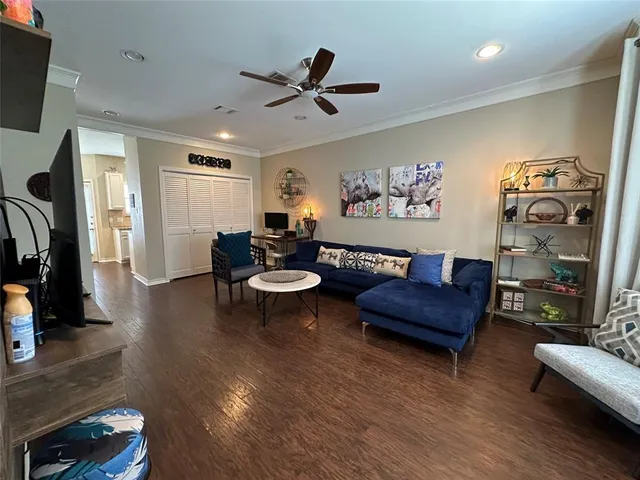 a view of a dining room with furniture wooden floor and chandelier