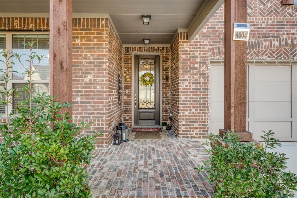 4804 Long Pond Trail Flower Mound, TX 76262 - Photo 2 of 22 front view of a brick house with a large windows
