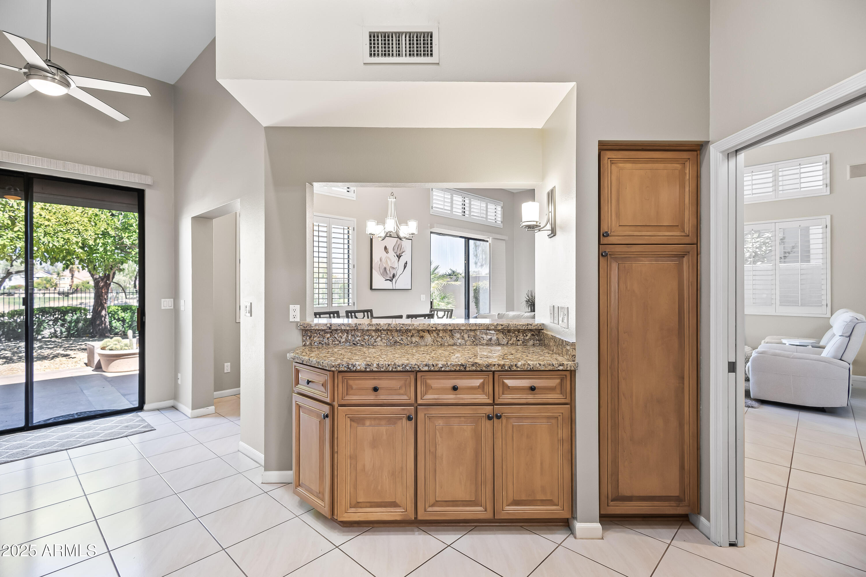 7740 East Gainey Ranch Road, Unit 23 Scottsdale, AZ 85258 - Photo 8 of 45 KITCHEN - PANTRY + SERVING BAR