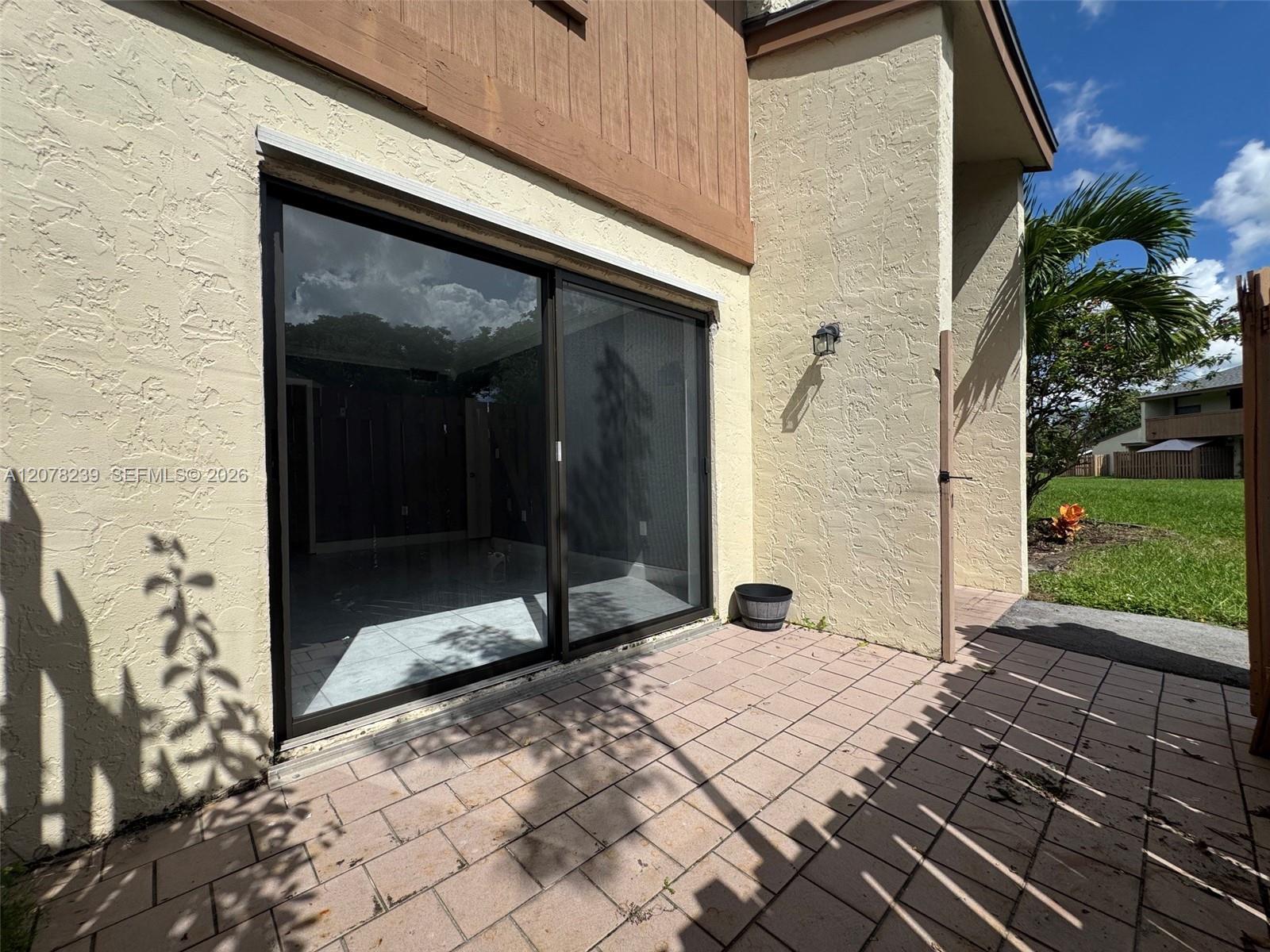 11467 Southwest 109th Road, Unit 7B Miami, FL 33176 - Photo 23 of 45 Front Patio