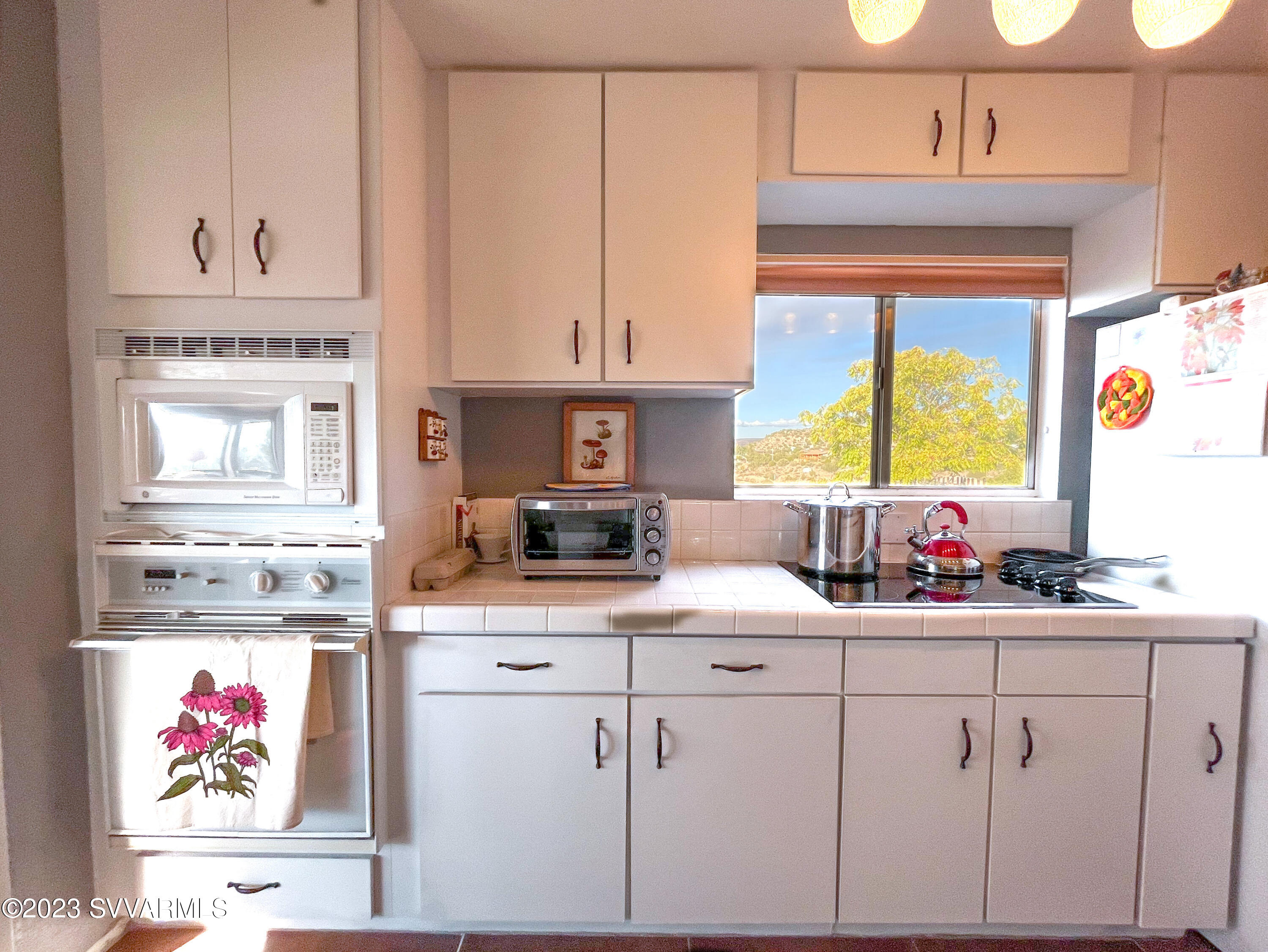 4605 Pima Way Rimrock, AZ 86335 - Photo 14 of 77 a kitchen with cabinets and window