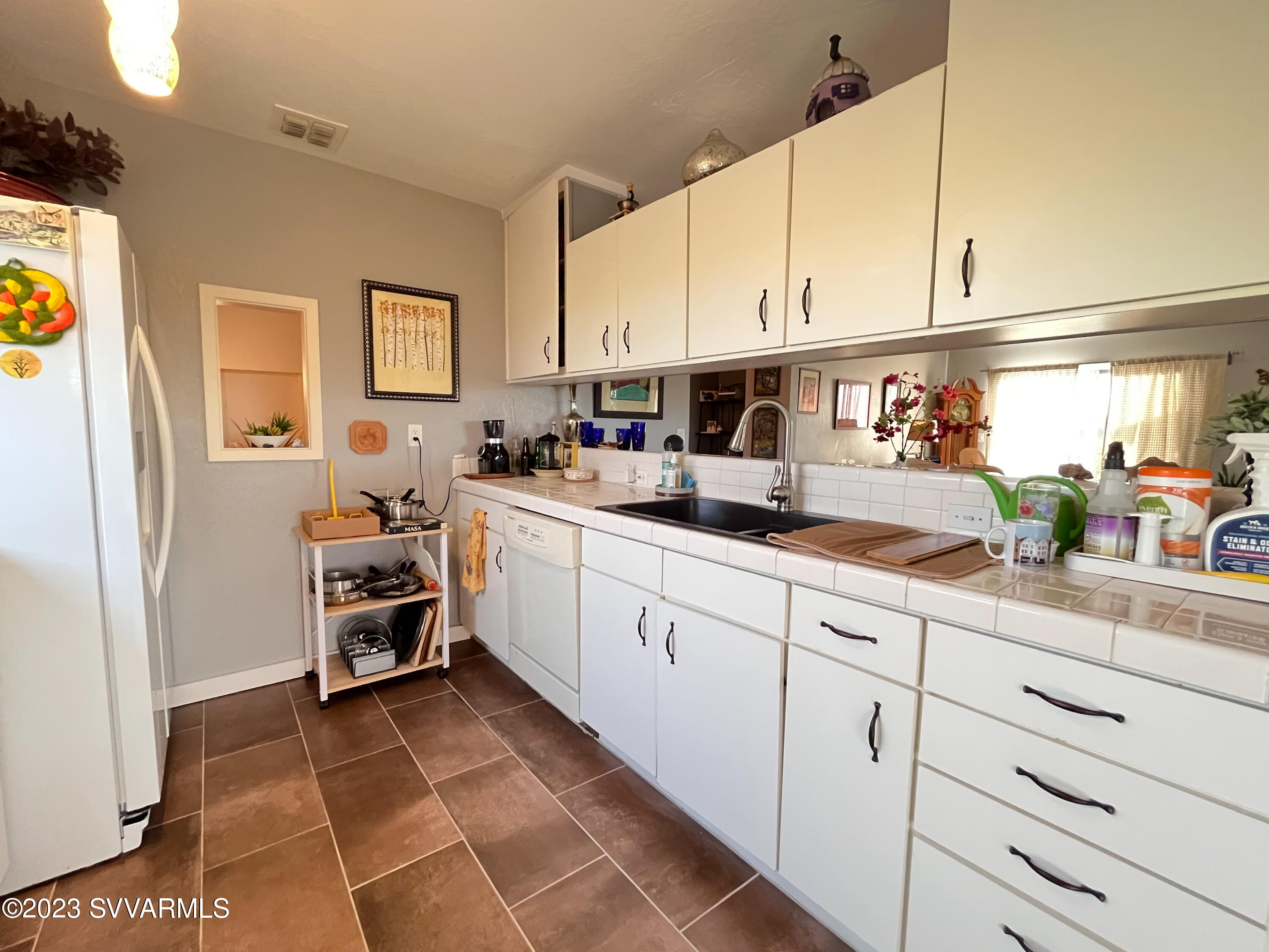 4605 Pima Way Rimrock, AZ 86335 - Photo 16 of 77 a kitchen with stainless steel appliances a sink a refrigerator and cabinets