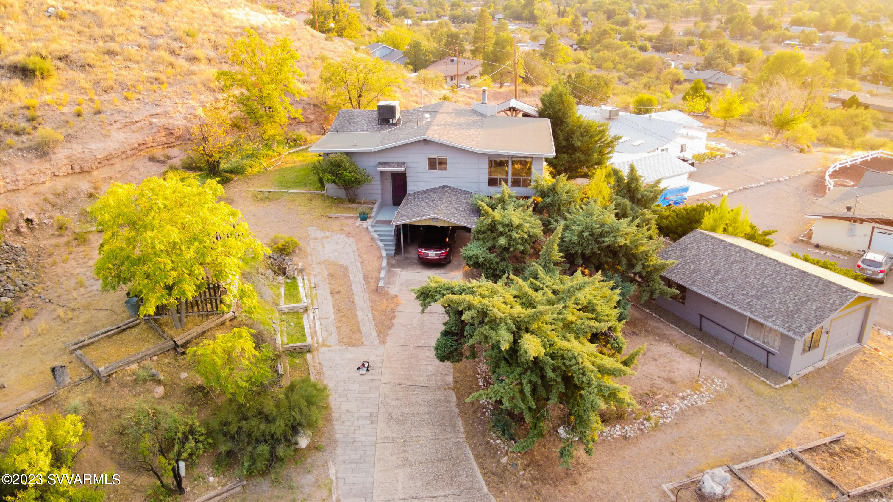 4605 Pima Way Rimrock, AZ 86335 - Photo 2 of 77 a front view of a house with a yard and flowers
