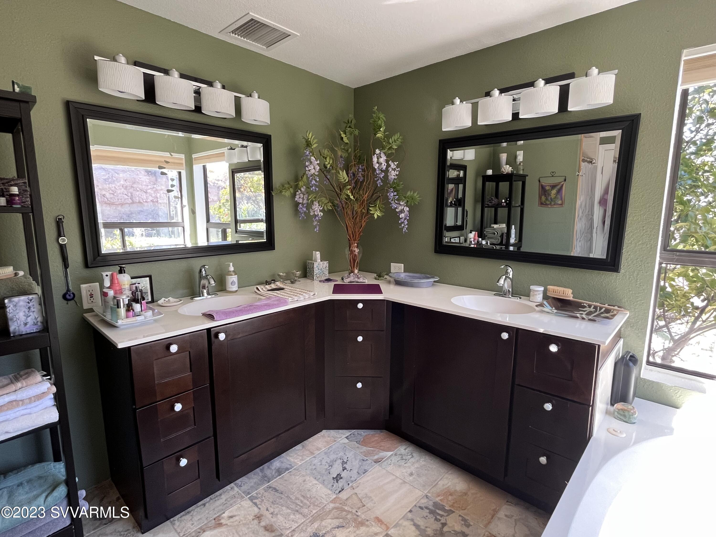 4605 Pima Way Rimrock, AZ 86335 - Photo 30 of 77 a bathroom with a sink vanity and a mirror