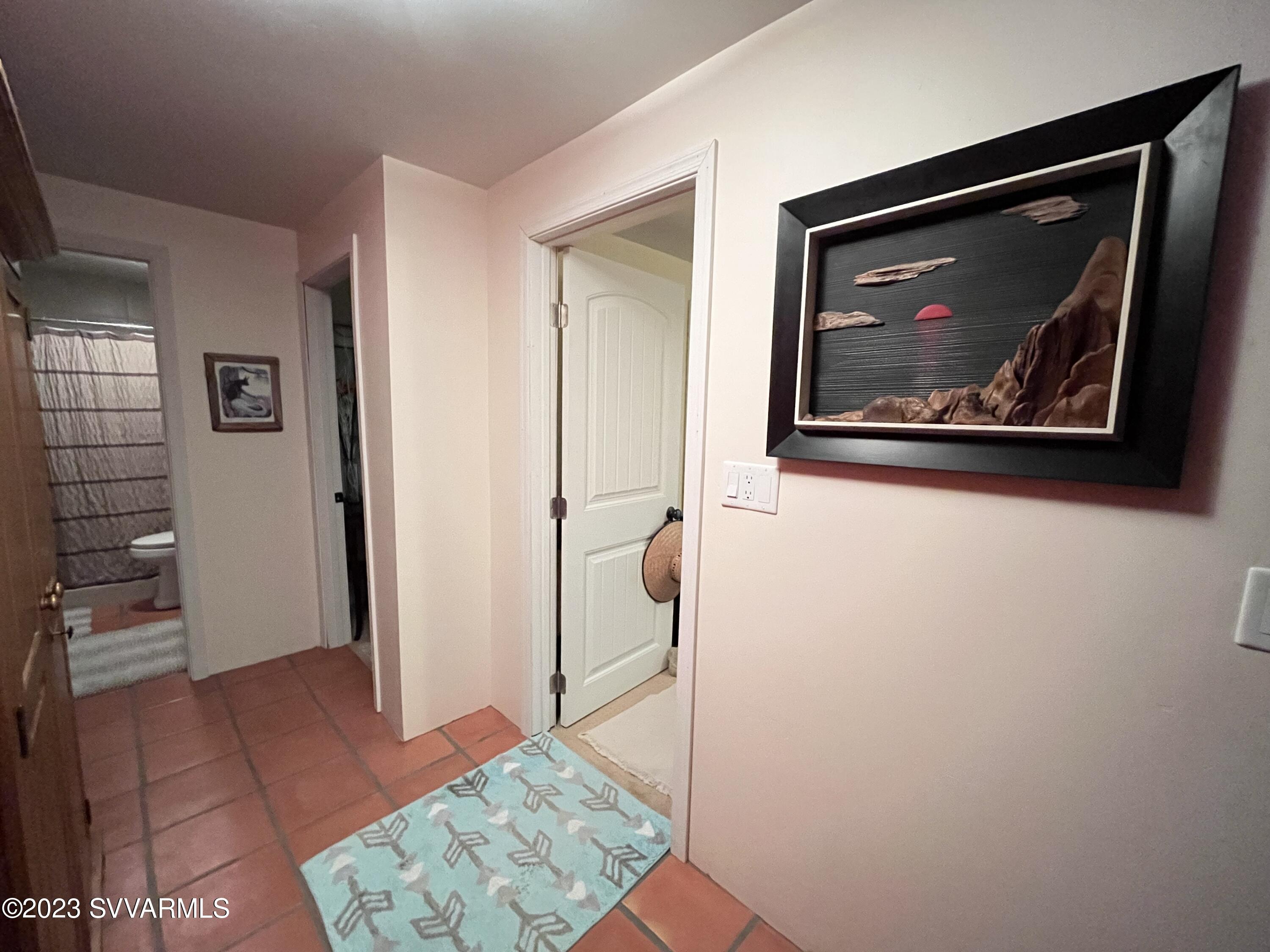 4605 Pima Way Rimrock, AZ 86335 - Photo 36 of 77 a view of a hallway with paintings on the wall