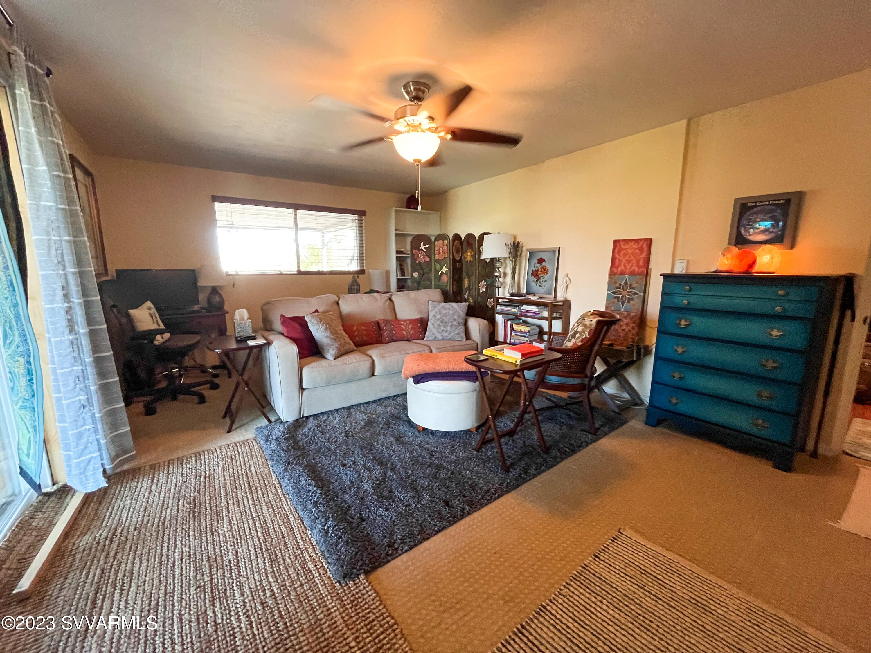 4605 Pima Way Rimrock, AZ 86335 - Photo 38 of 77 a living room with furniture a chandelier fan and a rug