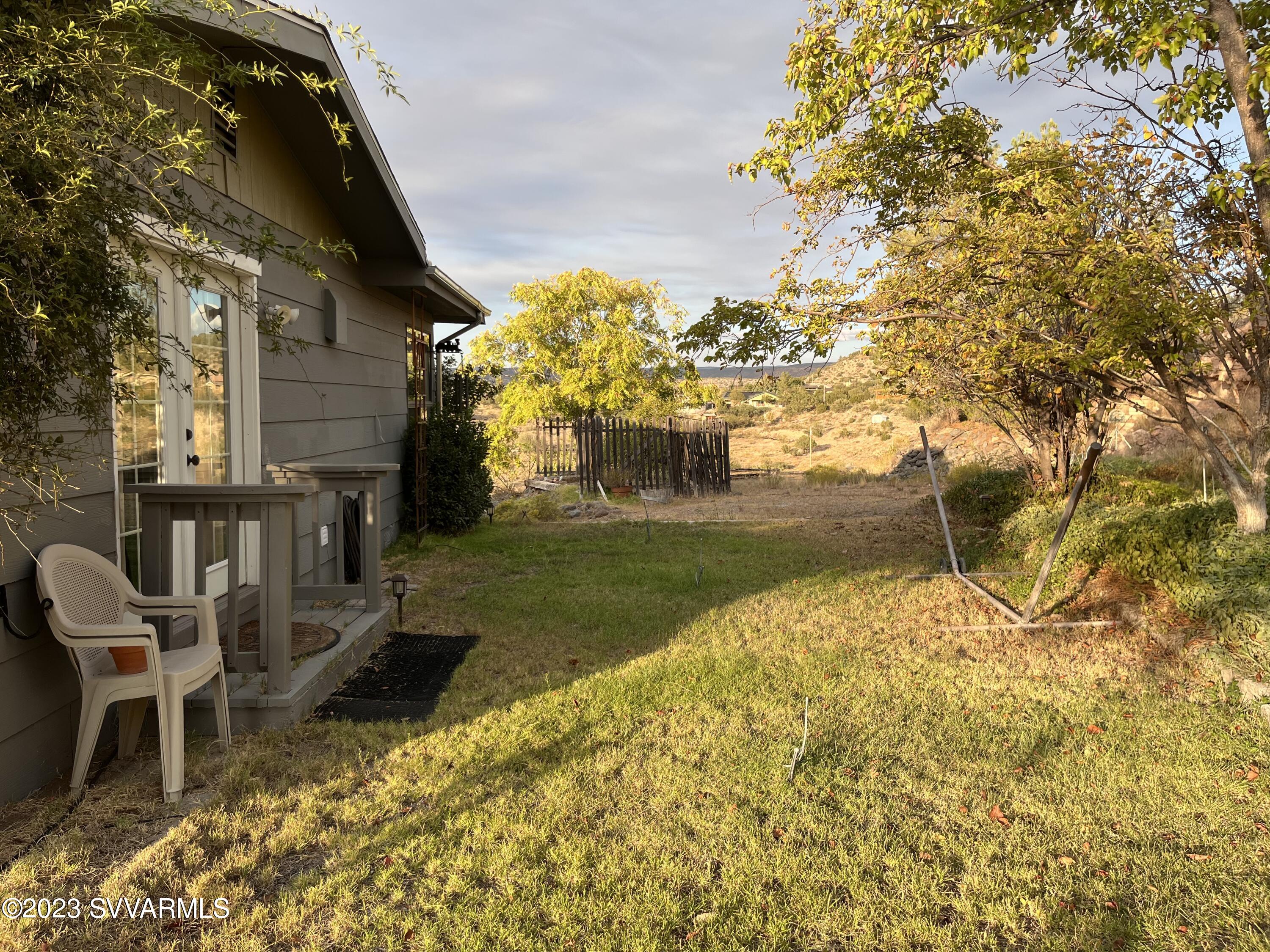 4605 Pima Way Rimrock, AZ 86335 - Photo 60 of 77 a backyard of a house with table and chairs