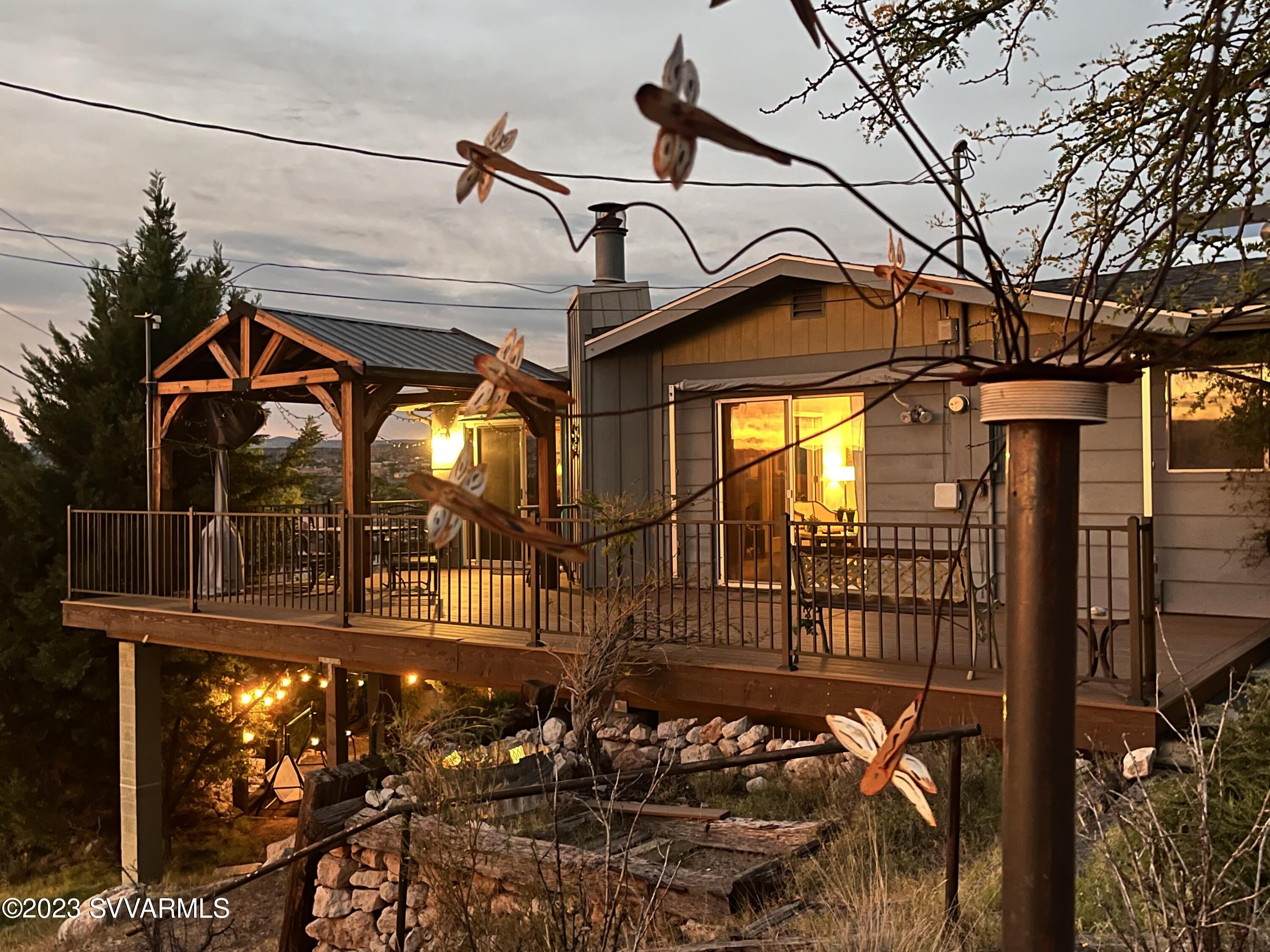 4605 Pima Way Rimrock, AZ 86335 - Photo 76 of 77 a view of a house with a small yard and a wooden deck