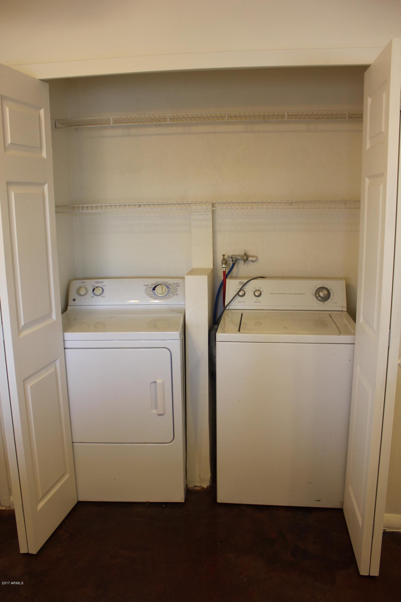 52727 West Roan Road Maricopa, AZ 85139 - Photo 21 of 27 Washer & Dryer off Kitchen