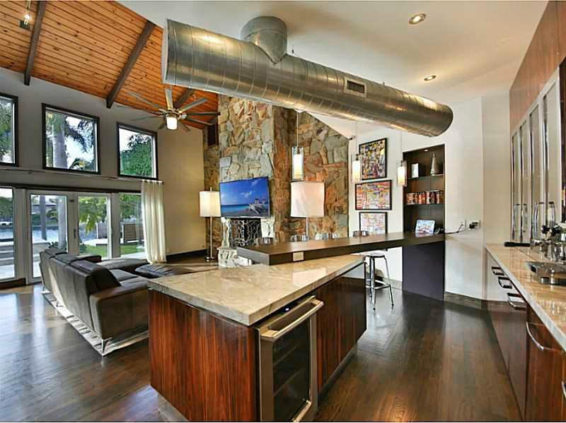 1 Seneca Road Sea Ranch Lakes, FL 33308 - Photo 13 of 35 a kitchen with stainless steel appliances granite countertop a stove and a sink