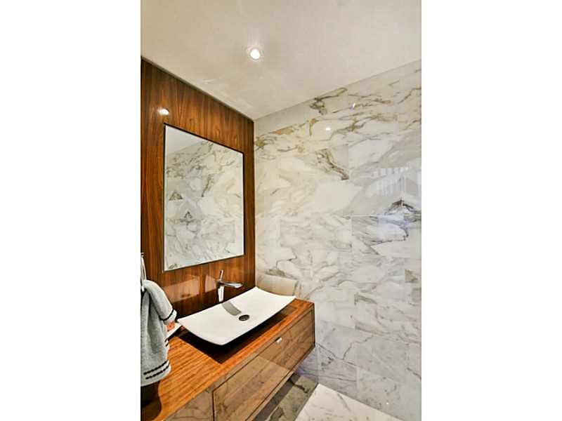 1 Seneca Road Sea Ranch Lakes, FL 33308 - Photo 14 of 35 a view of bathroom with a shower and a sink