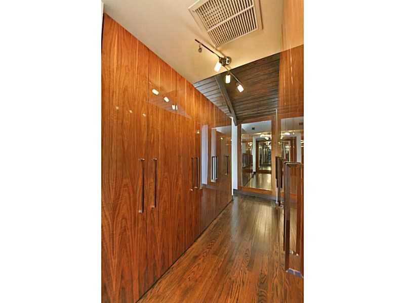 1 Seneca Road Sea Ranch Lakes, FL 33308 - Photo 22 of 35 a view of a hallway with wooden floor