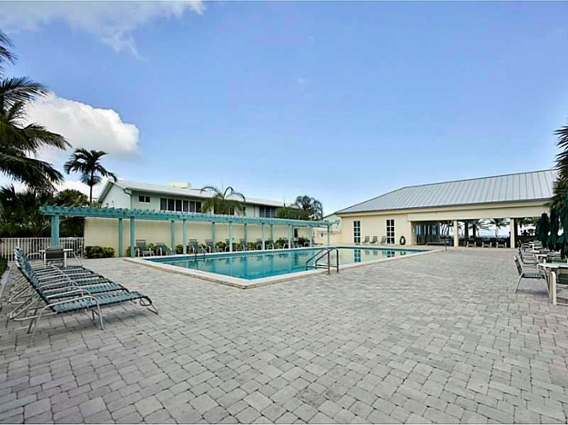 1 Seneca Road Sea Ranch Lakes, FL 33308 - Photo 32 of 35 a view of a house with backyard and porch