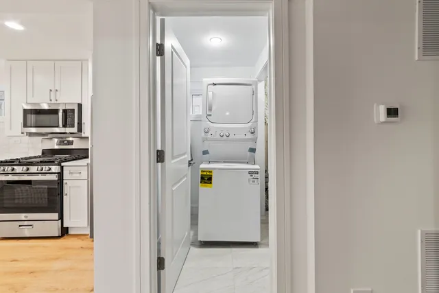 a view of a kitchen from the hallway