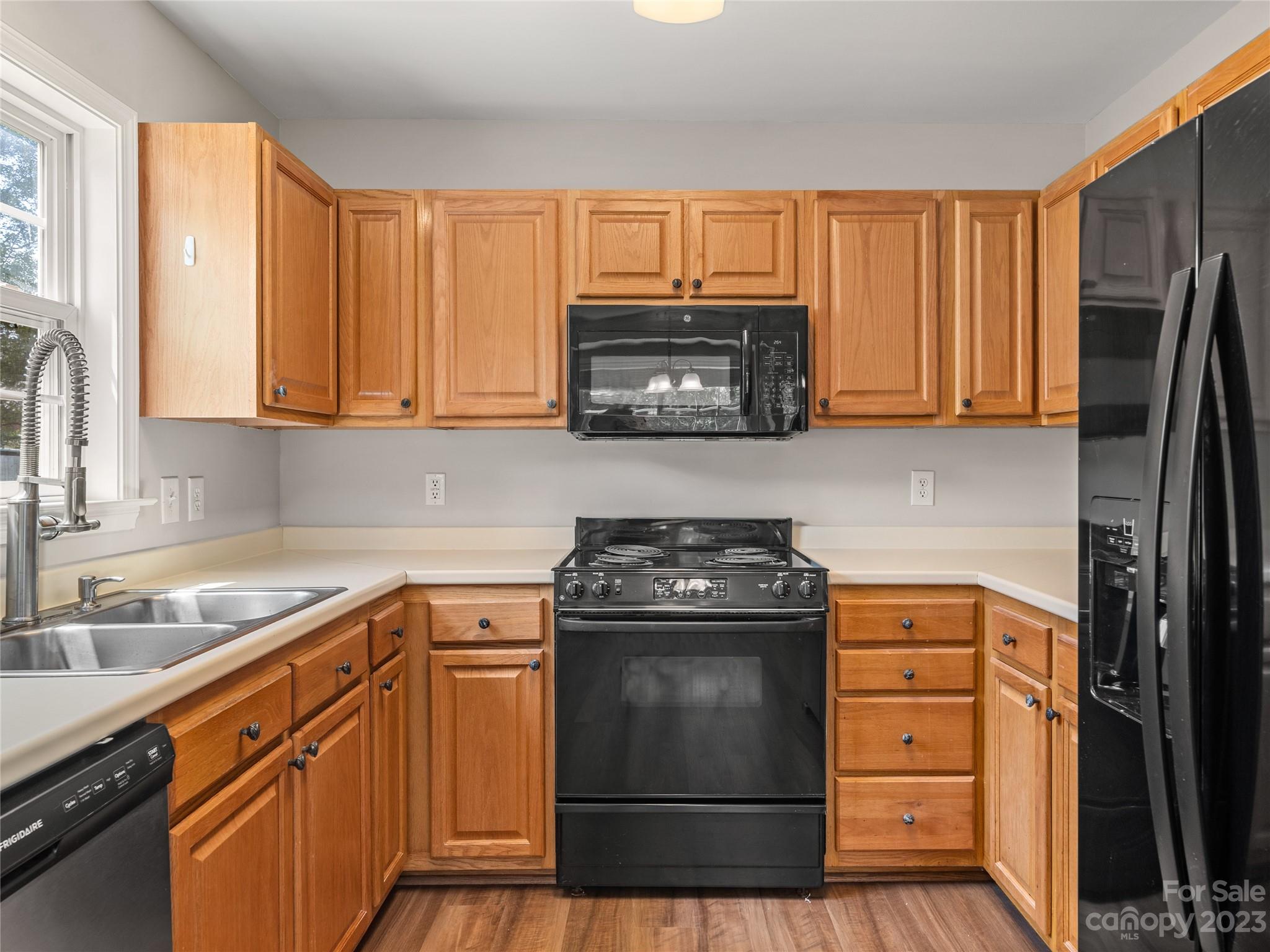 238 English Oak Road Fletcher, NC 28732 - Photo 13 of 25 a kitchen with a stove microwave and sink