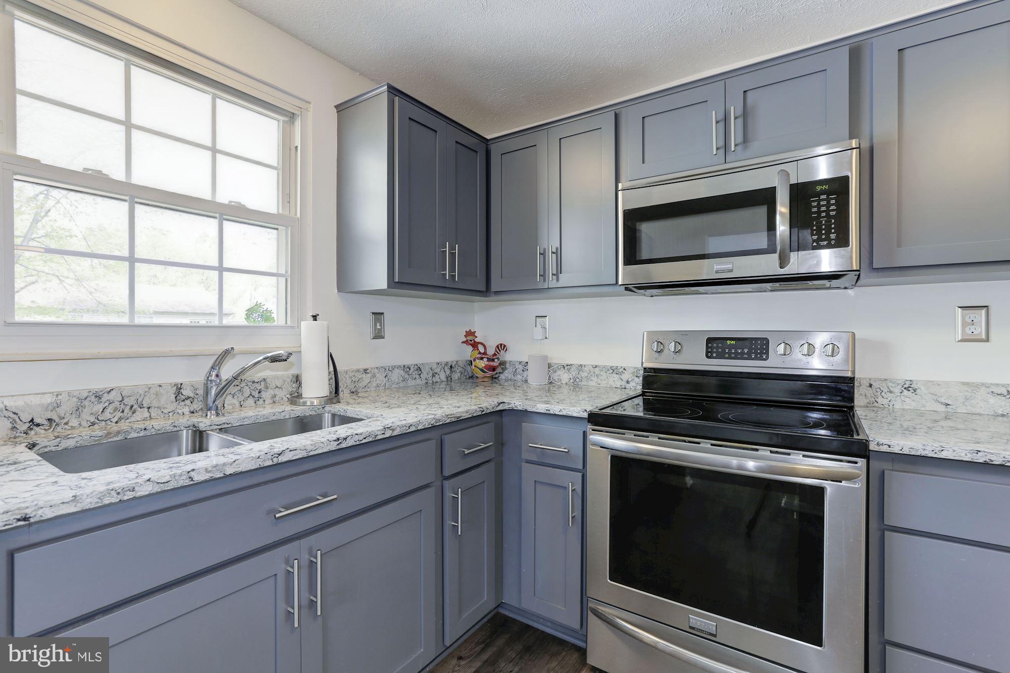 9418 Northgate Road Laurel, MD 20723 - Photo 14 of 49 Quartz countertops and SS appliances