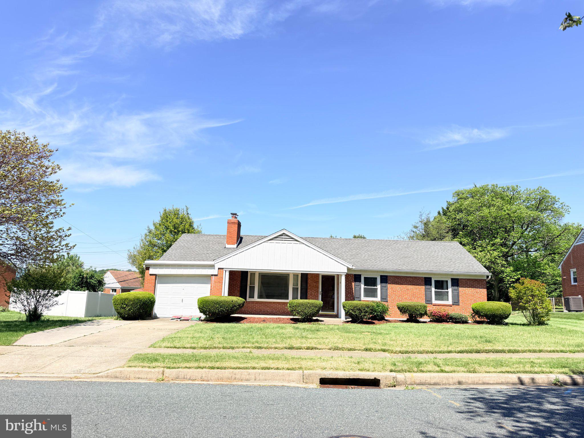 6 East Aylesbury Road Lutherville-Timonium, MD 21093 - Photo 1 of 19 Charming brick home with lush greenery.
