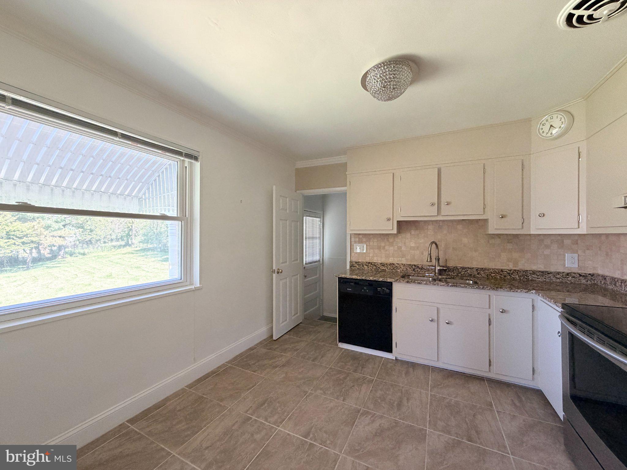 6 East Aylesbury Road Lutherville-Timonium, MD 21093 - Photo 5 of 19 Bright and airy kitchen with views.